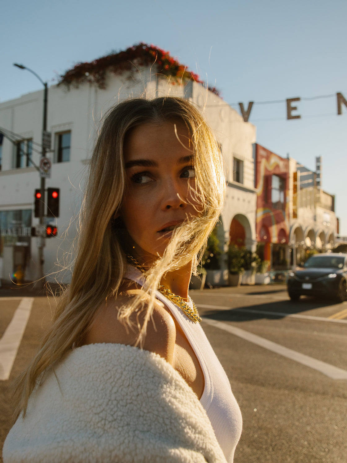 blonde model crossing abbot kinney boulevard venice california