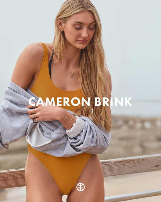 Cameron Brink in a swimsuit. 'Cameron Brink' text overlay