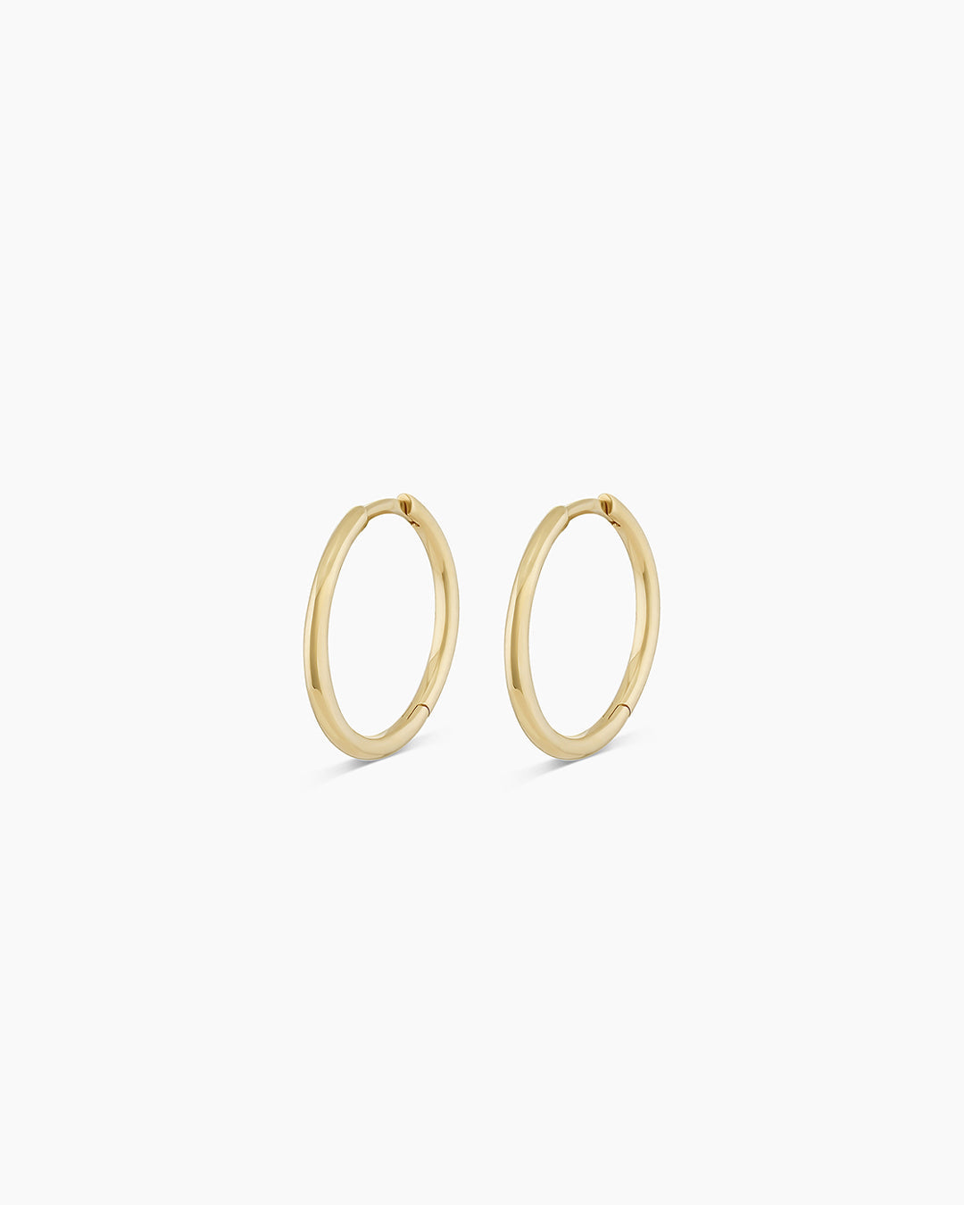 Woman wearing Classic Gold Huggie || option::14k Solid Gold, 15mm
