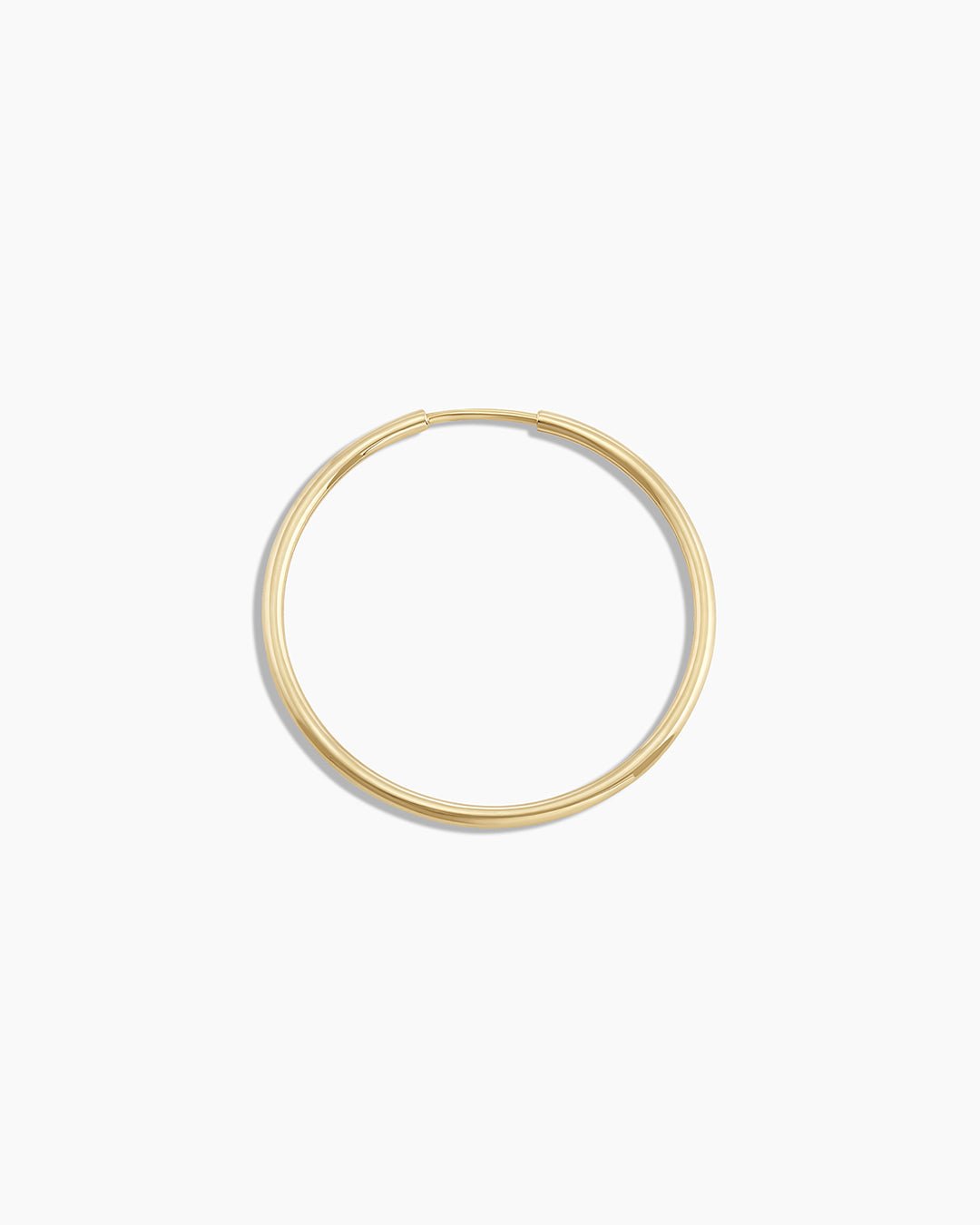 Woman wearing Classic Gold Hoop || option::14k Solid Gold, 22mm, Single