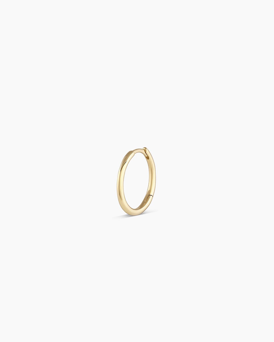 Woman wearing Classic Gold Huggie || option::14k Solid Gold, 13mm, Single