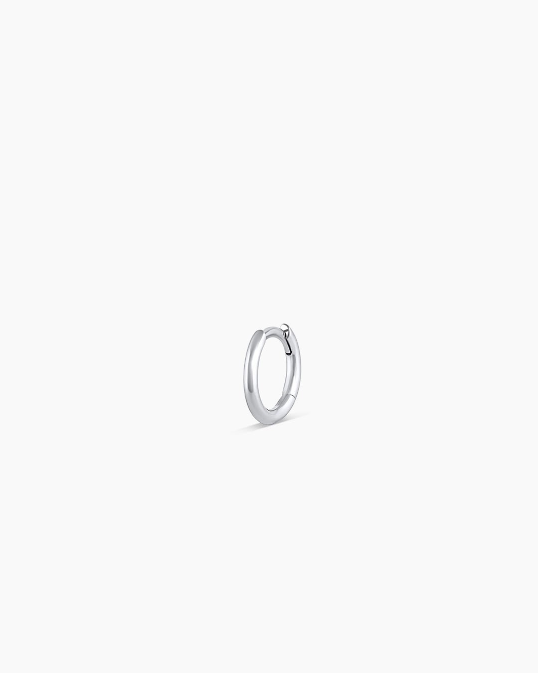 Woman wearing Classic Gold Huggie || option::14k Solid White Gold, 8mm, Single