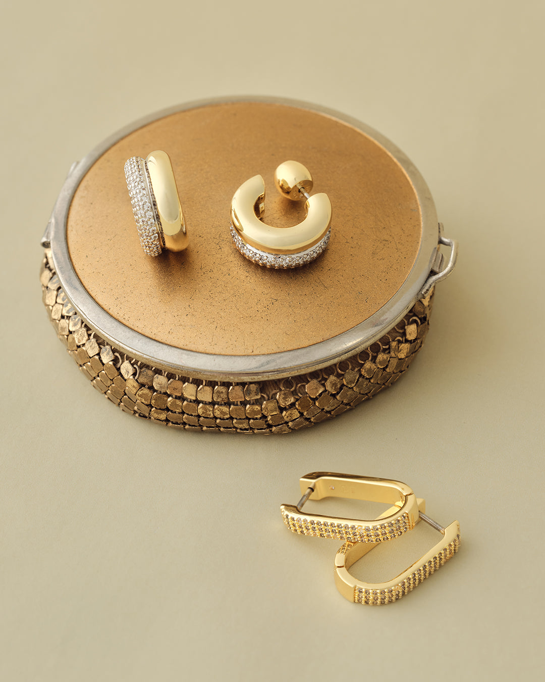 gold plated shimmer huggies. Shop Earrings