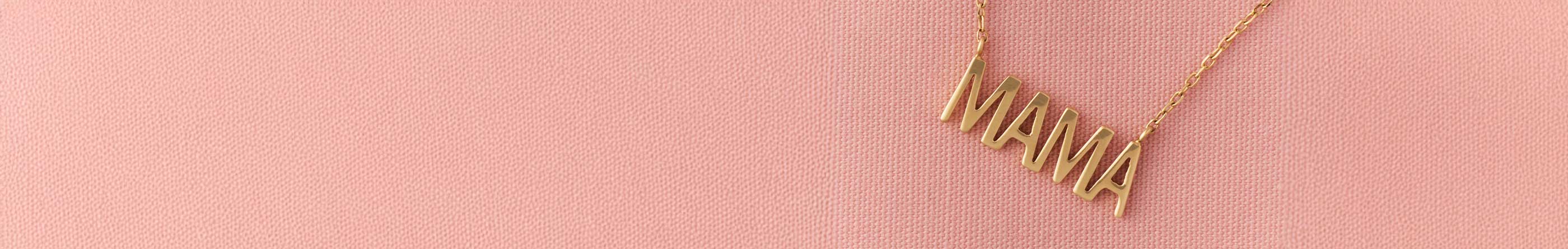 Gold 'MAMA' necklace on a pink background. Support Baby 2 Baby