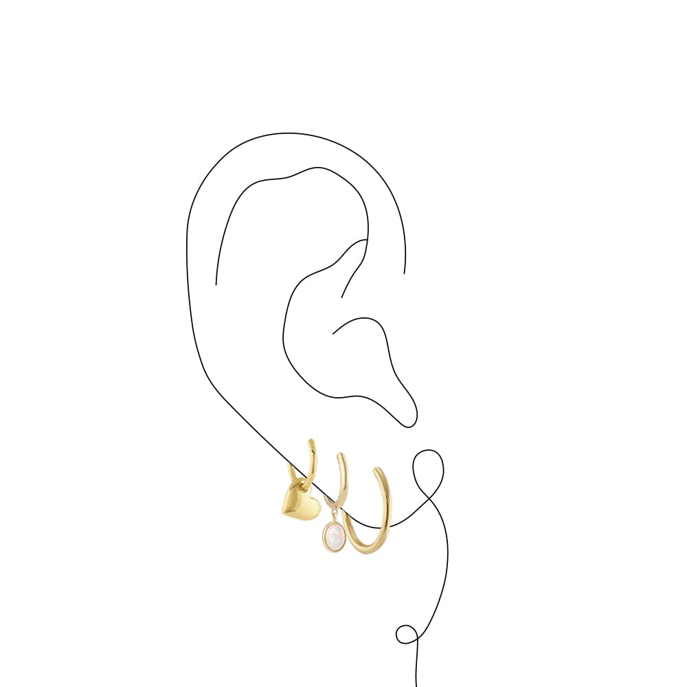Graphic of ear with three gold hoop earrings