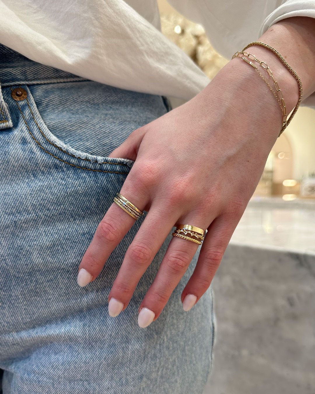 Woman wearing 14k gold rings 