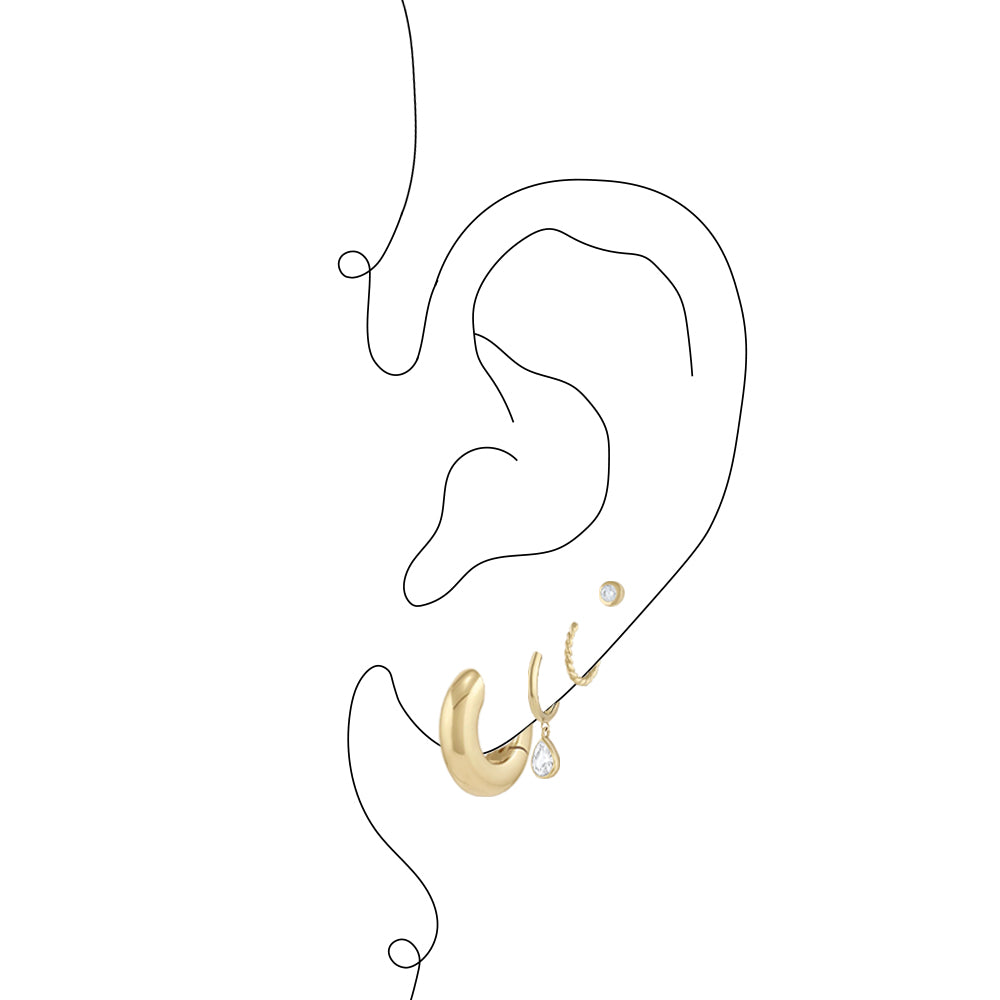 Graphic of ear with three gold hoops and a diamond stud