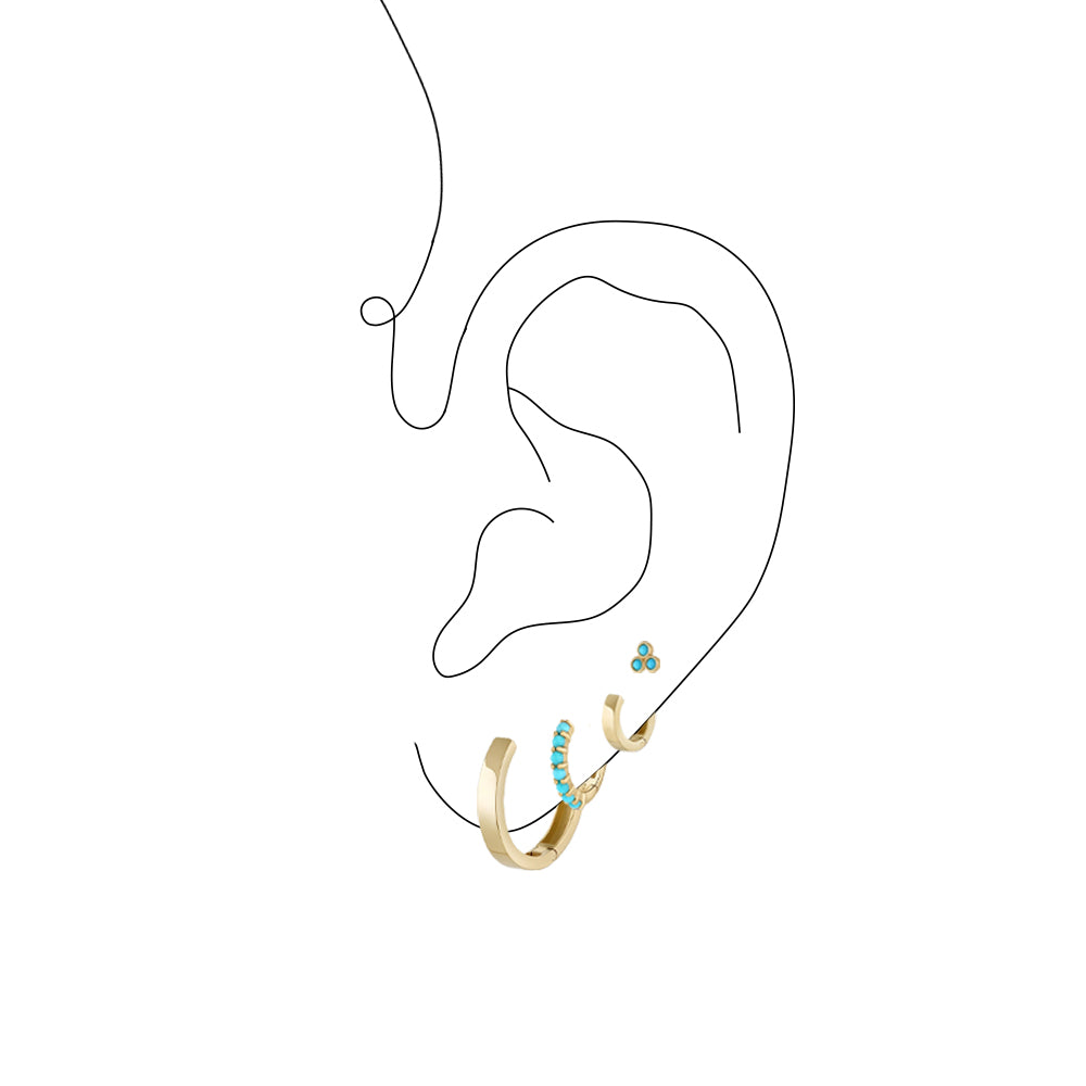 Ear graphic with turquoise and gold earrings