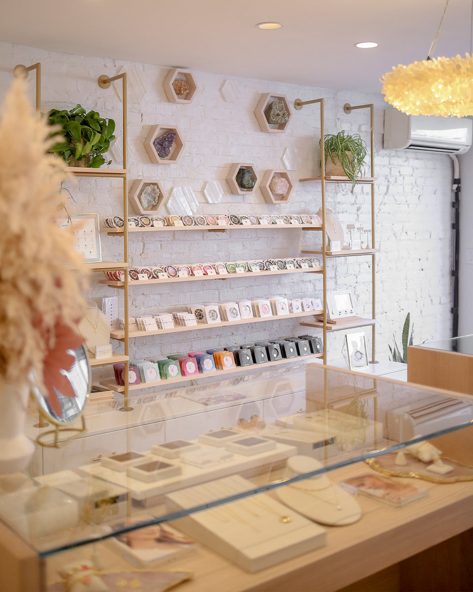 out of focus jewelry case with a wall of necklaces in focus