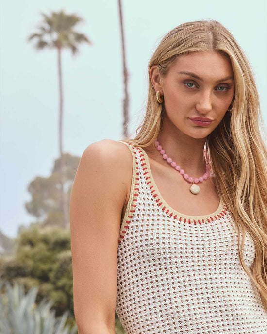 Cameron Brink wearing beaded summer jewelry and statement hoops