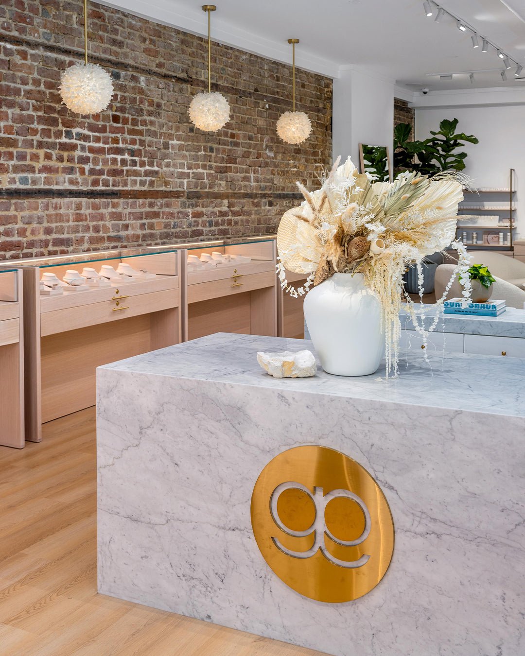 marble countertop with exposed brick wall