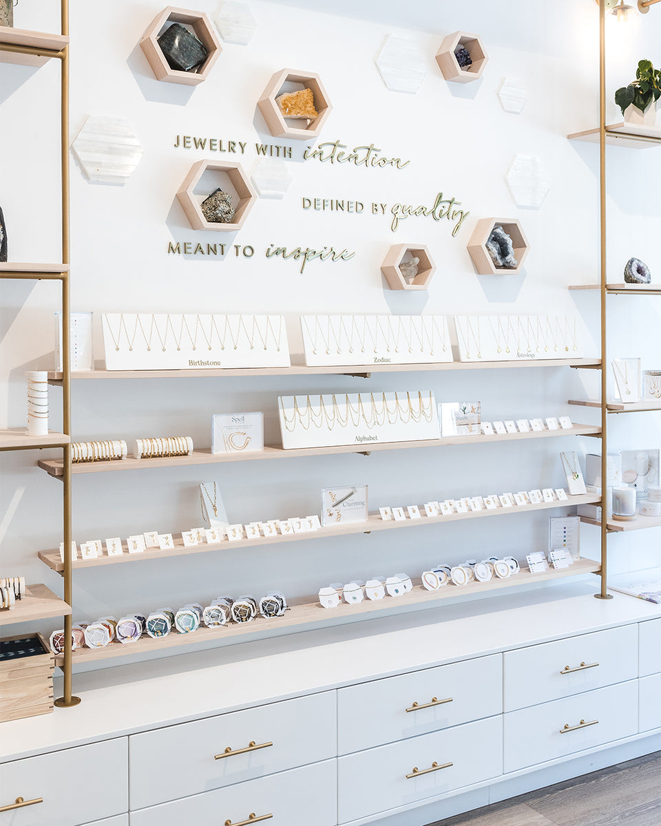 wall filled with gorjana jewelry in store