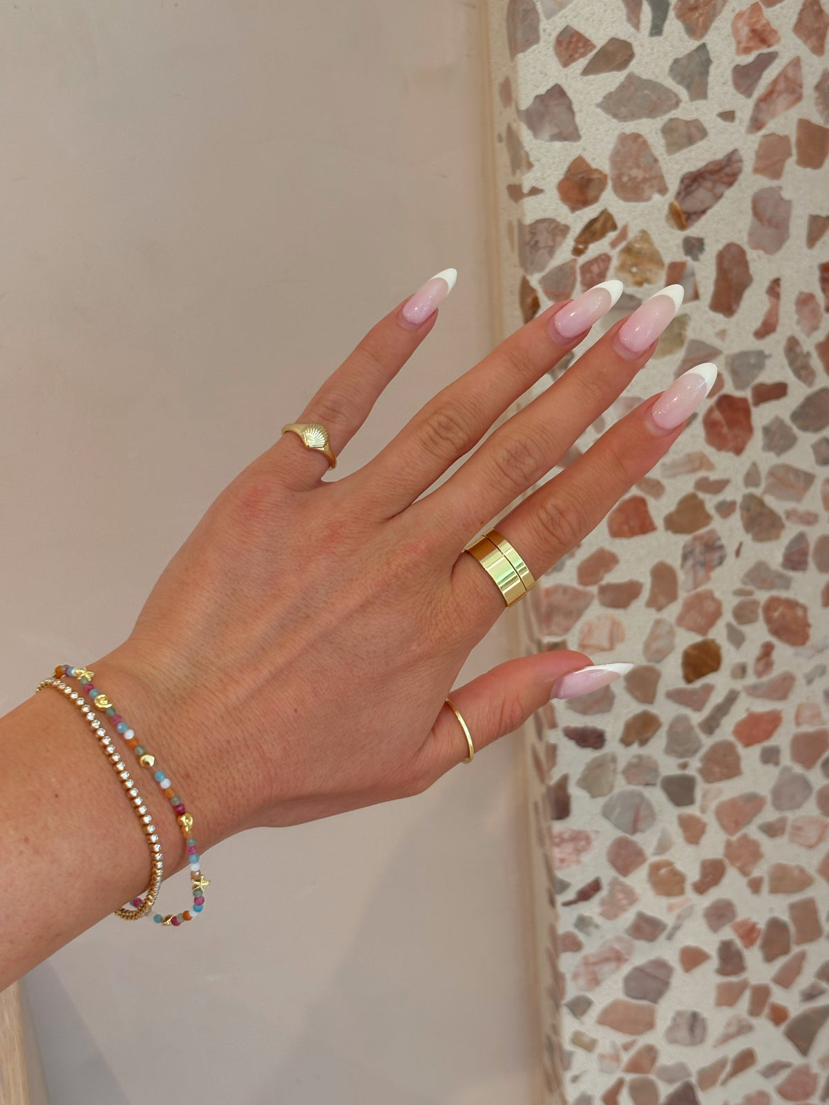 Stylist wearing the gorjana Rose Ring Set at gorjana Carlsbad