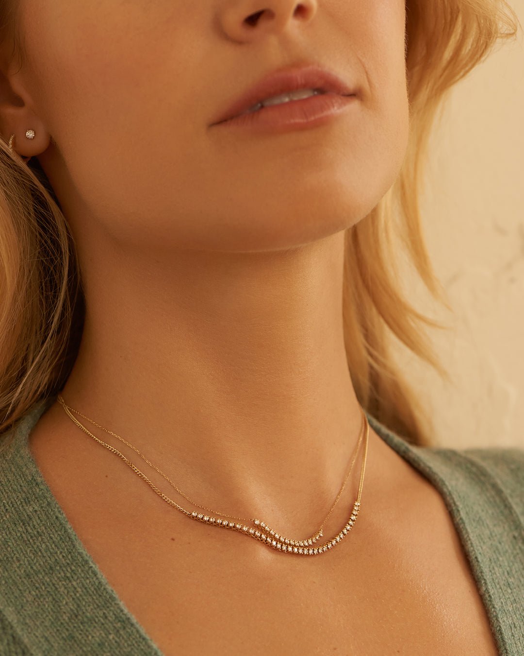 Woman wearing diamond necklaces.
