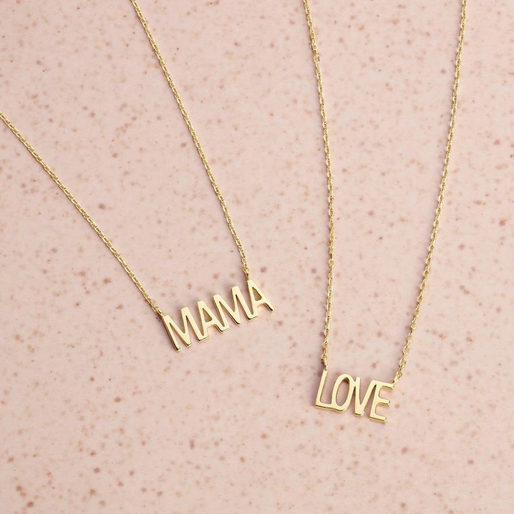 14k gold necklaces with the words "mama" and "love"  on them.