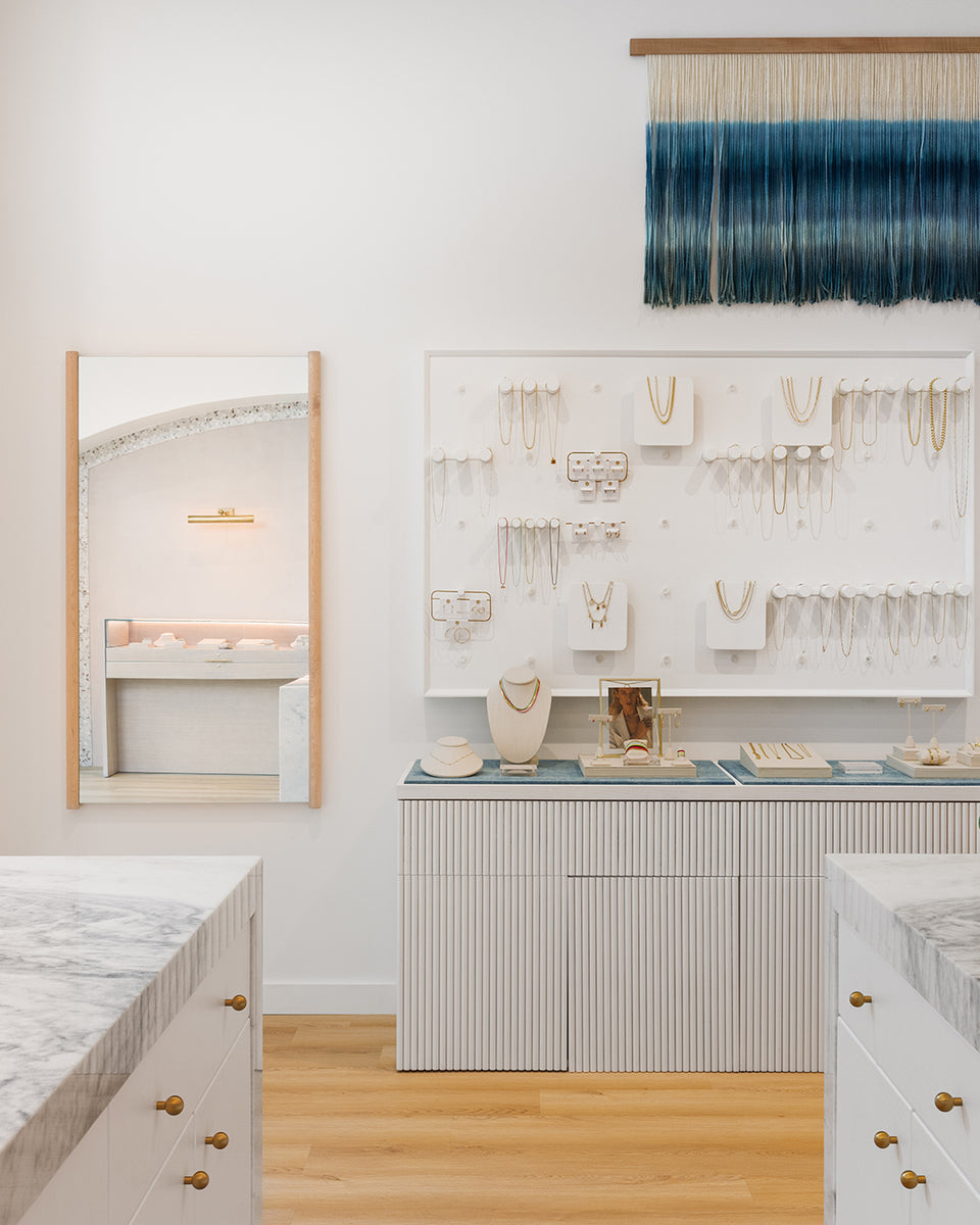 Interior of houston store with white, jewelry filled walls