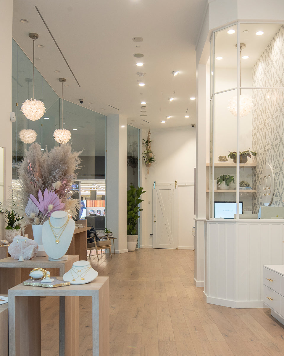 Interior of store with white walls and flowers