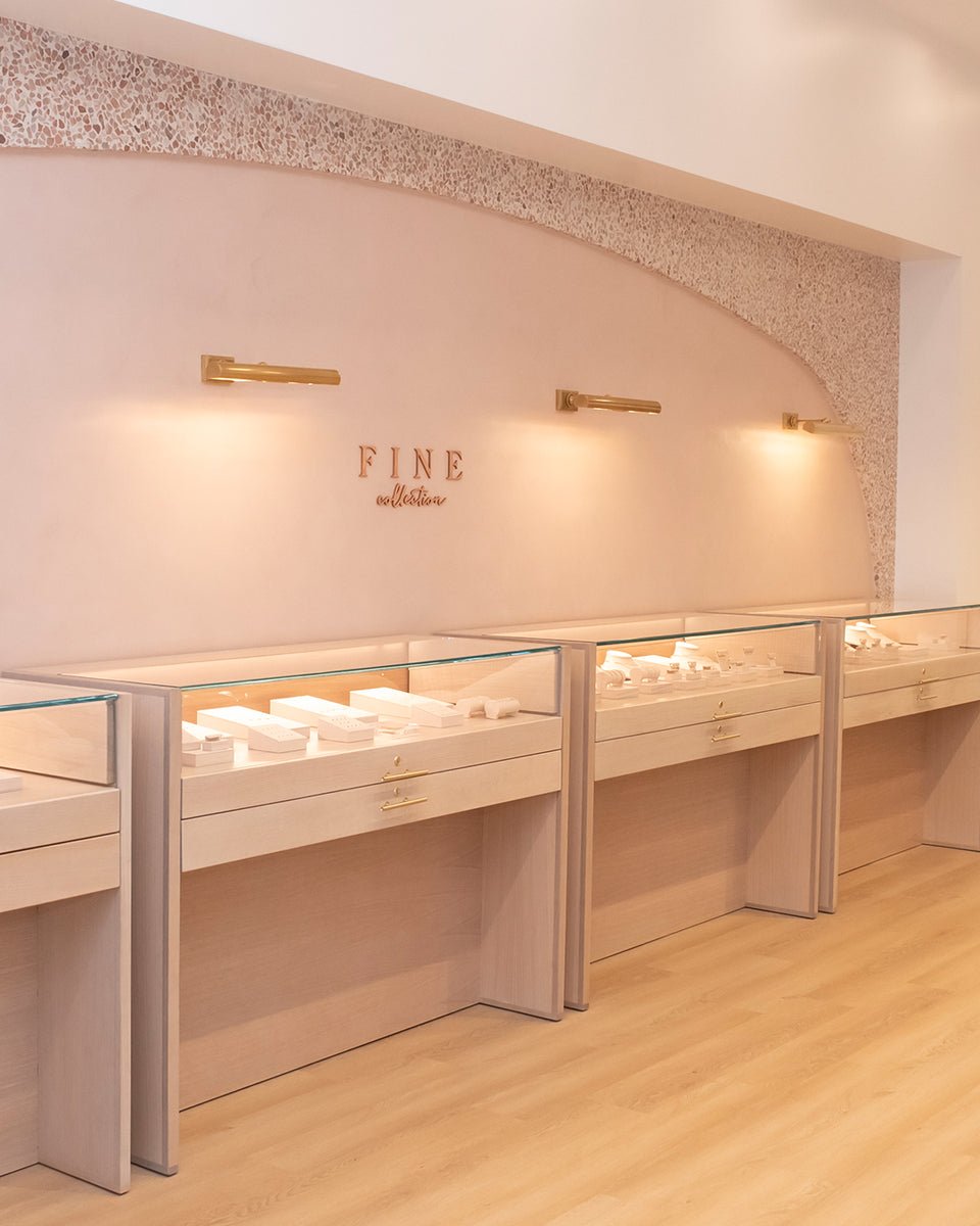 fine jewelry cases in gorjana store with mood lighting