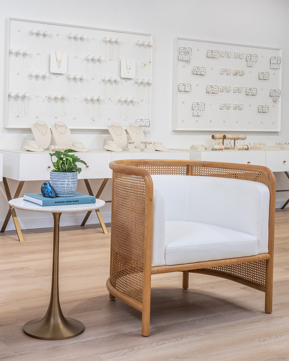 seating area with chair and side table in gorjana store