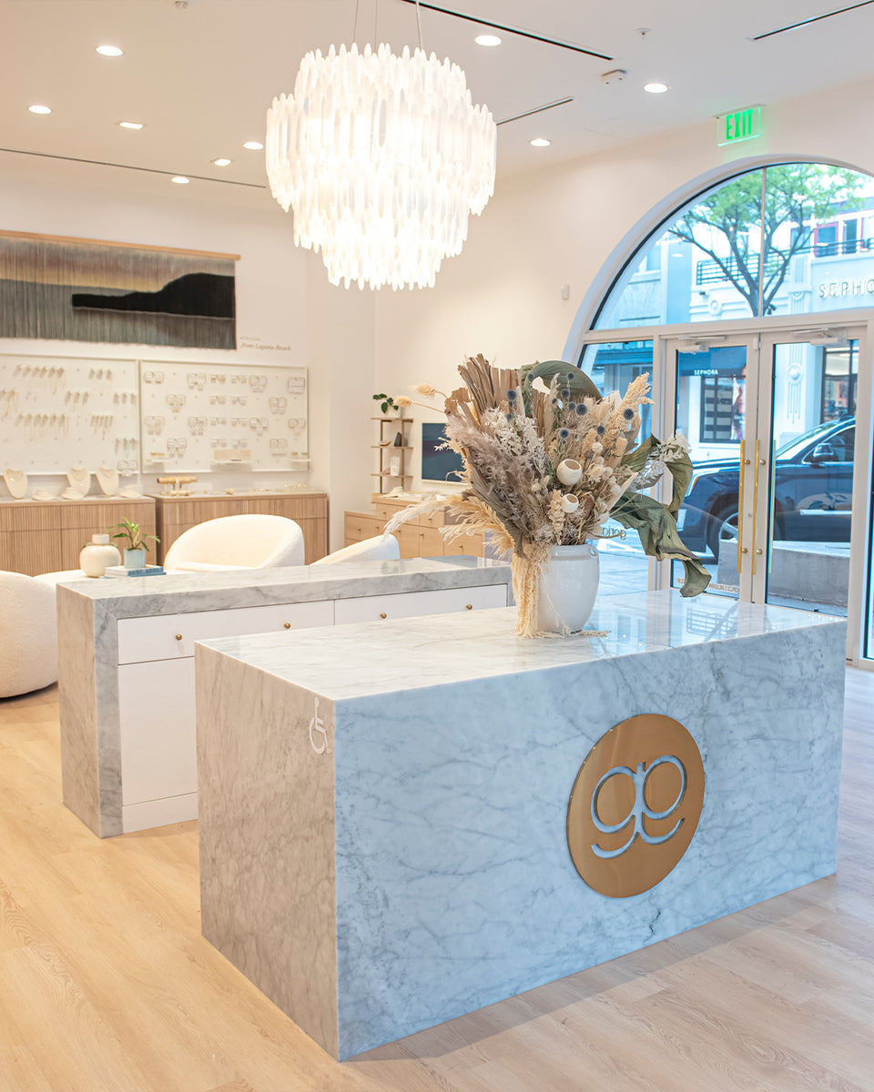 gorjana store with big window looking out over busy city street