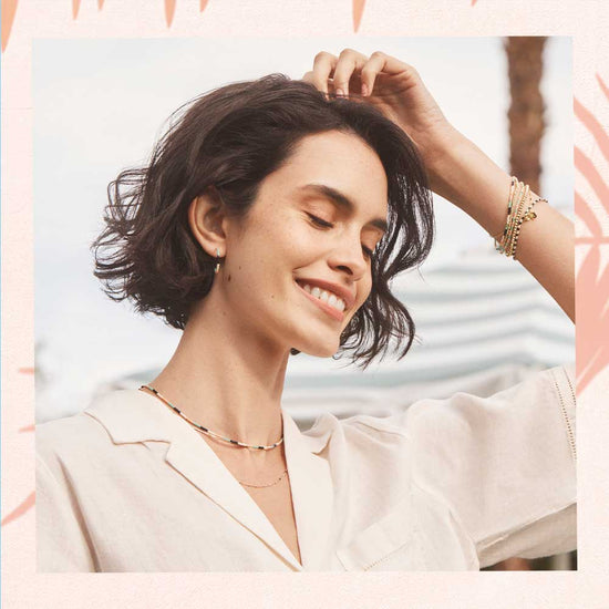 woman in colorful necklaces and bracelets