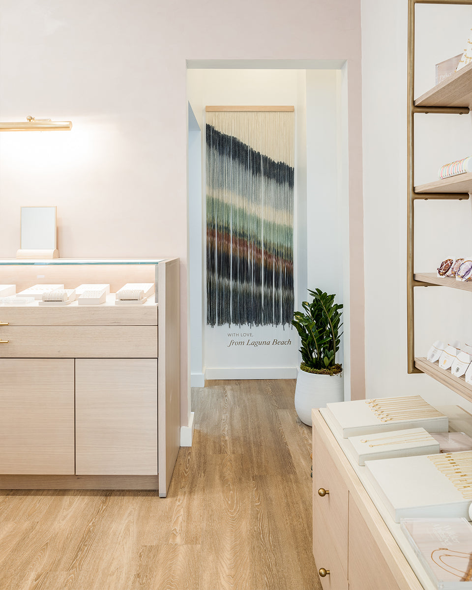 gorjana store interior with walls and cases of jewelry 