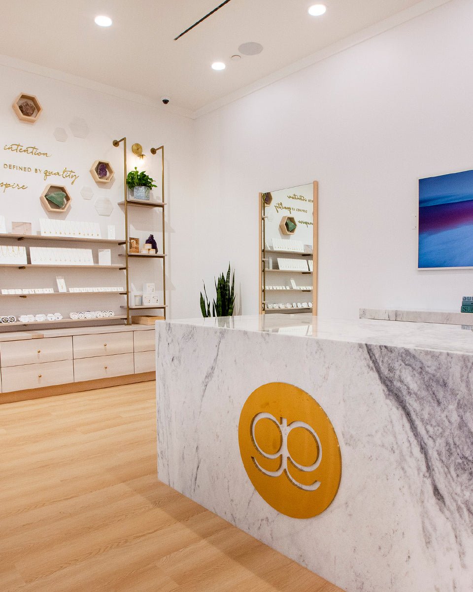interior of store with marble counter and gorjana logo
