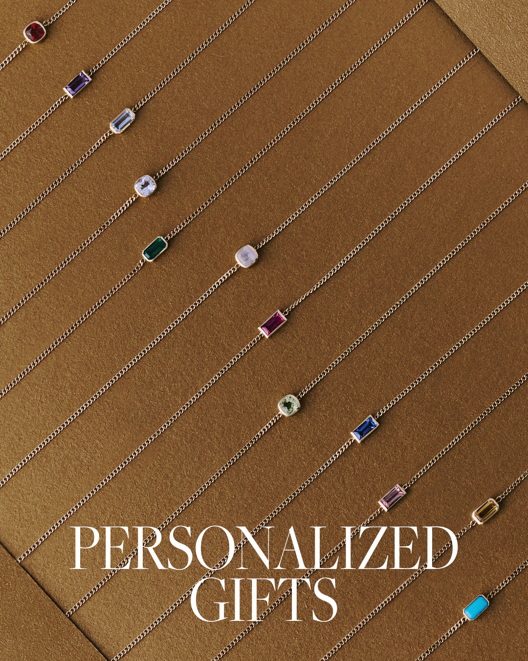 Jewelry with colored gemstones on a brown background with 'Personalized Gifts' text.