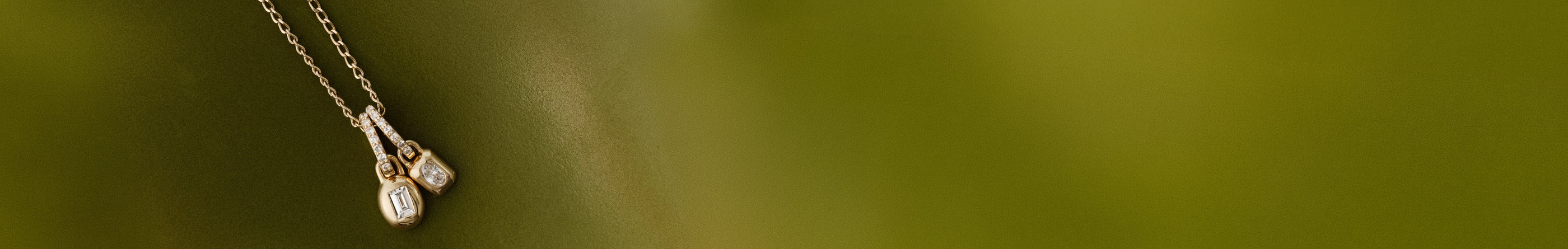 Lab Grown Diamond charms on a green background