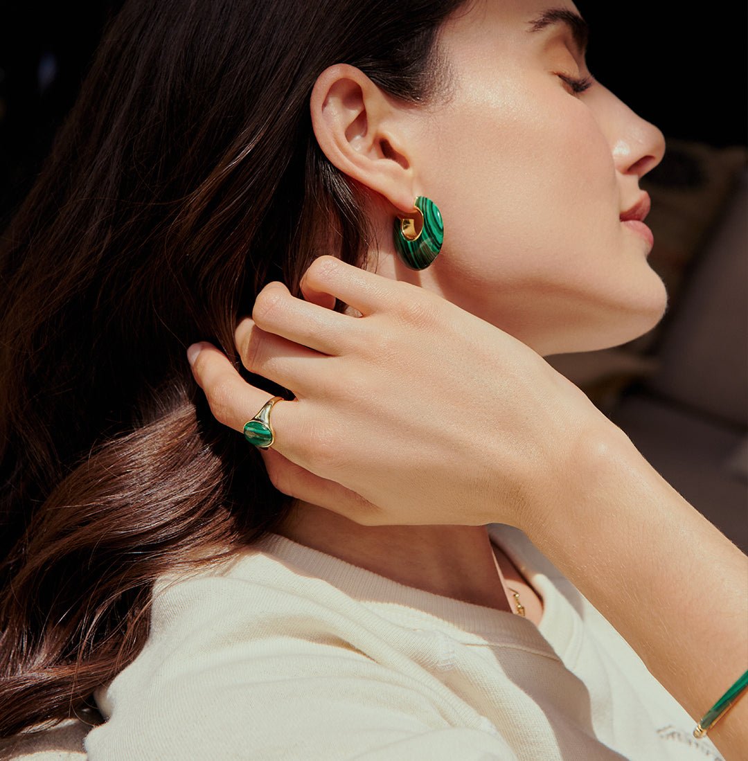 woman in malachite green statement hoop and ring