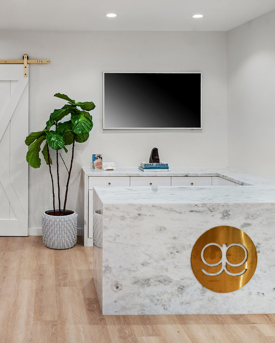 marble counter with gorjana logo 