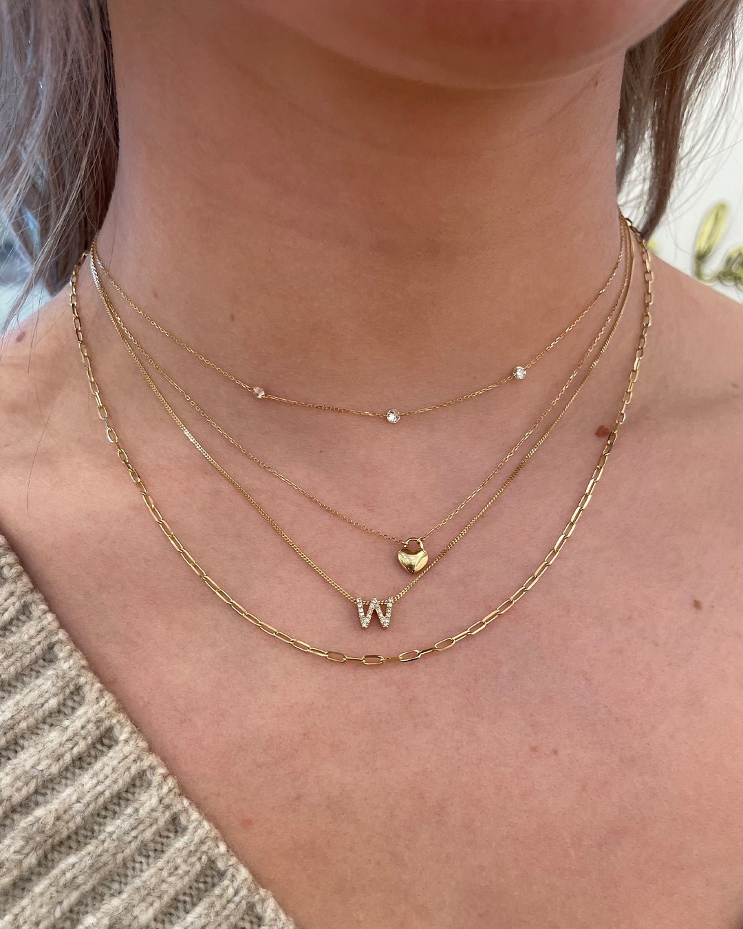 Woman wearing 14k gold necklaces