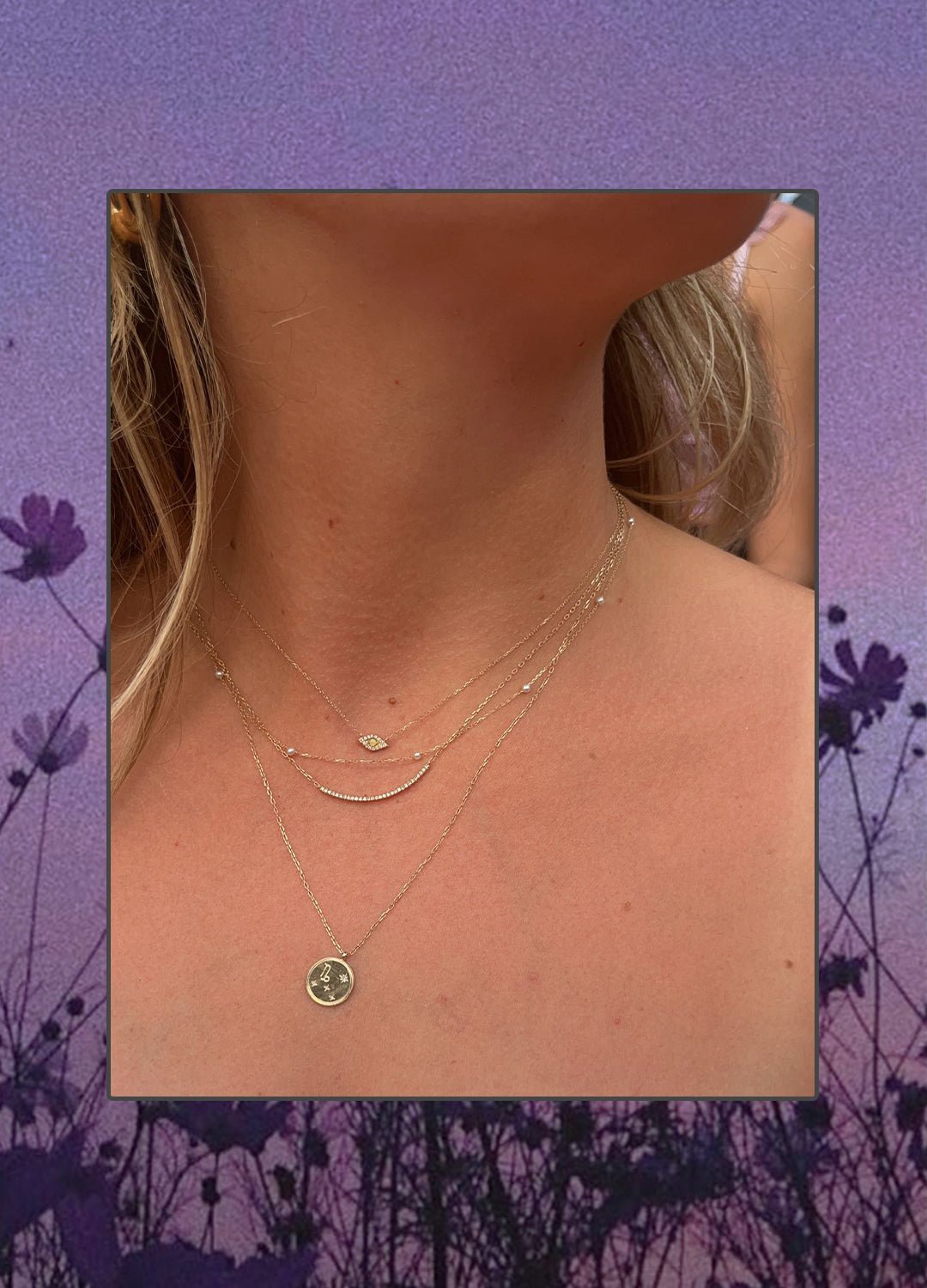 Woman wearing 14k gold and diamond necklaces.