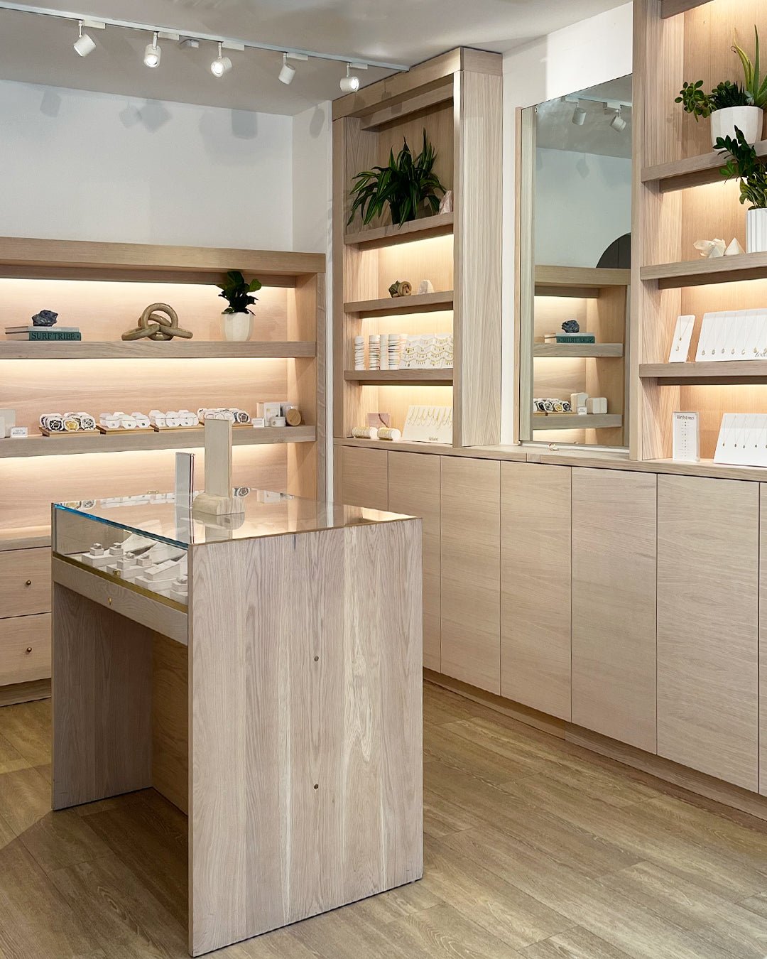 gorjana west village store with elevated wood cabinets and shelving