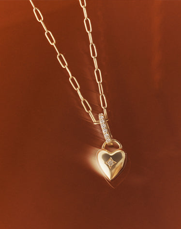 solid gold chain and heart charm