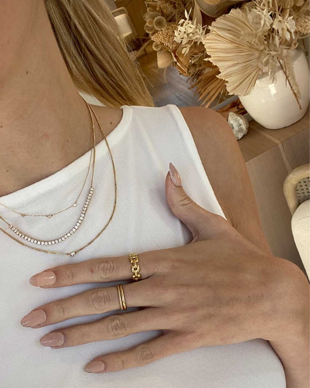 stylist wearing The Diamond Eve Necklace, Diamond Row Melbourne Statement Necklace, Diamond Wilder Necklace and Brooklyn Ring.
