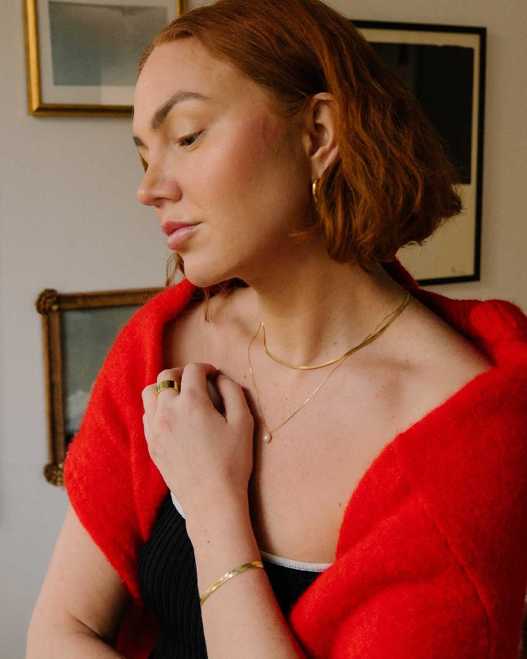 @alexismaymcmullin in the Venice Mini Necklace, Pearl Charm Necklace, Rose Ring, and Venice Bracelet.
