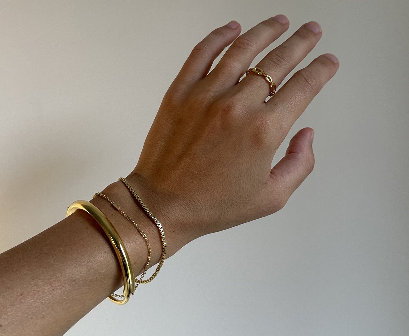 @ashleyellenhoward wearing gold plated bracelets
