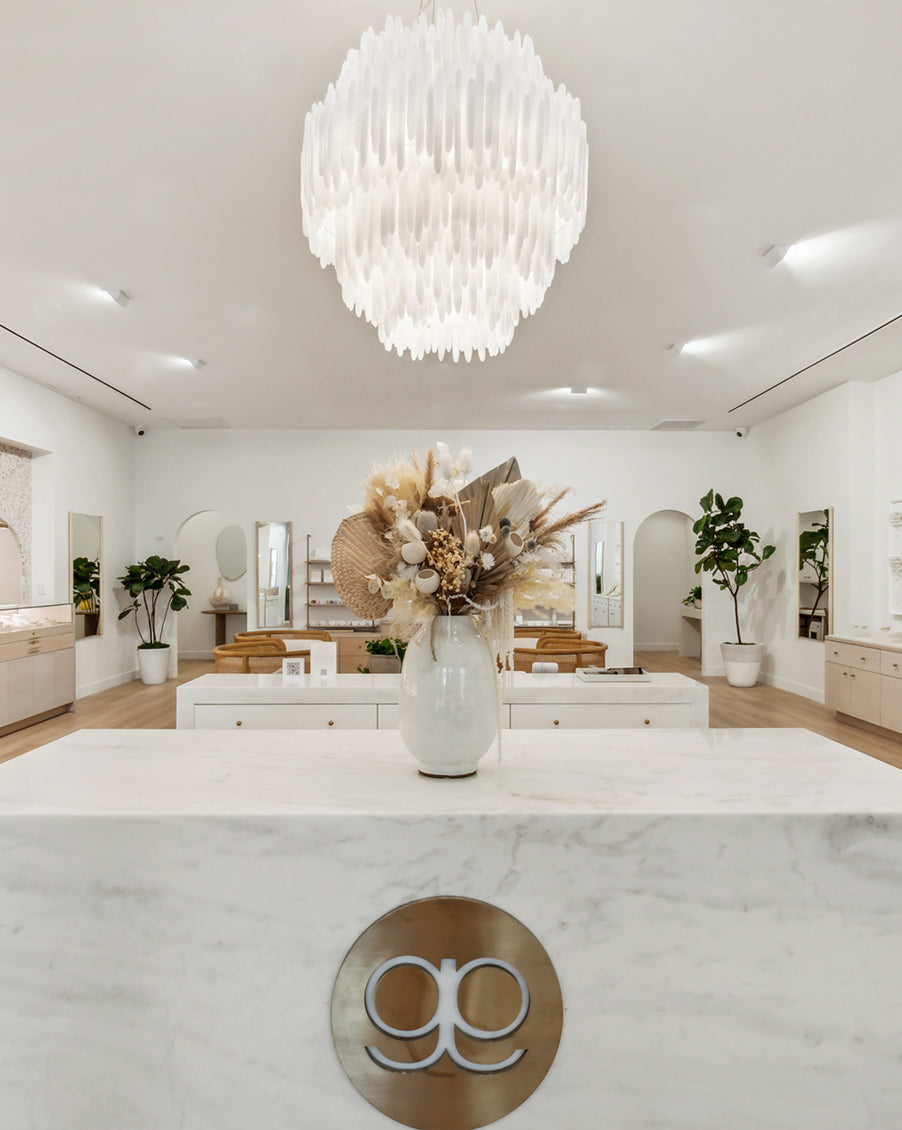 gorjana interior of white marble countertop with dried boho flowers