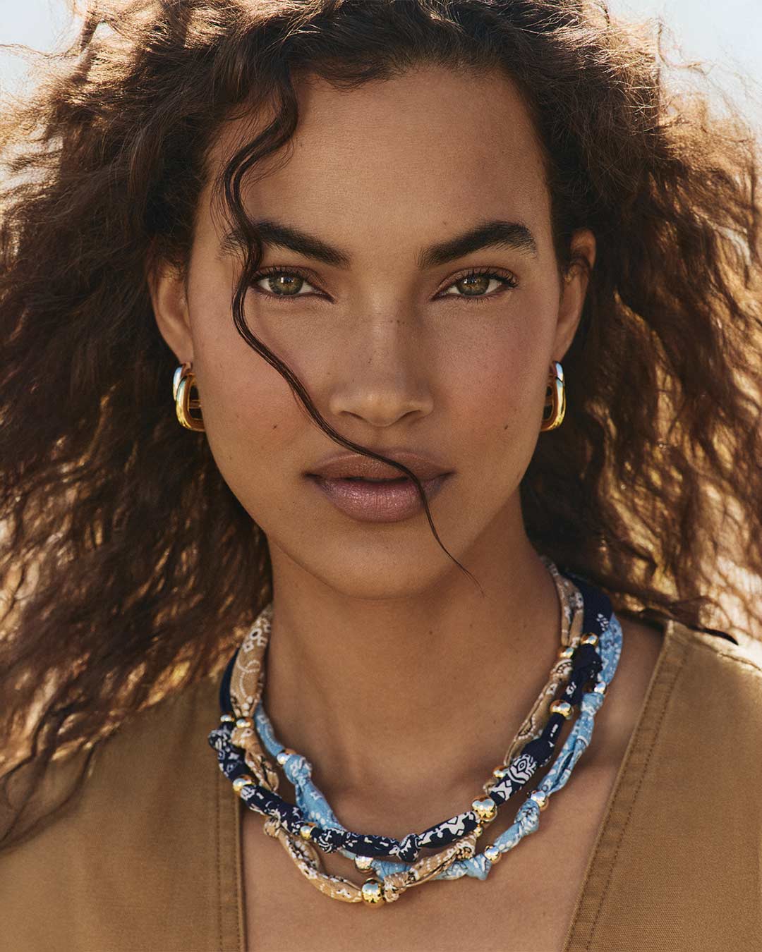 Woman wearing bandana necklaces