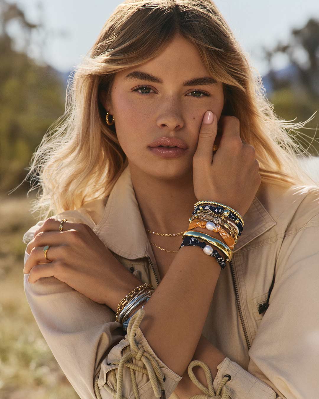 Woman wearing bandana and gold plated jewelry