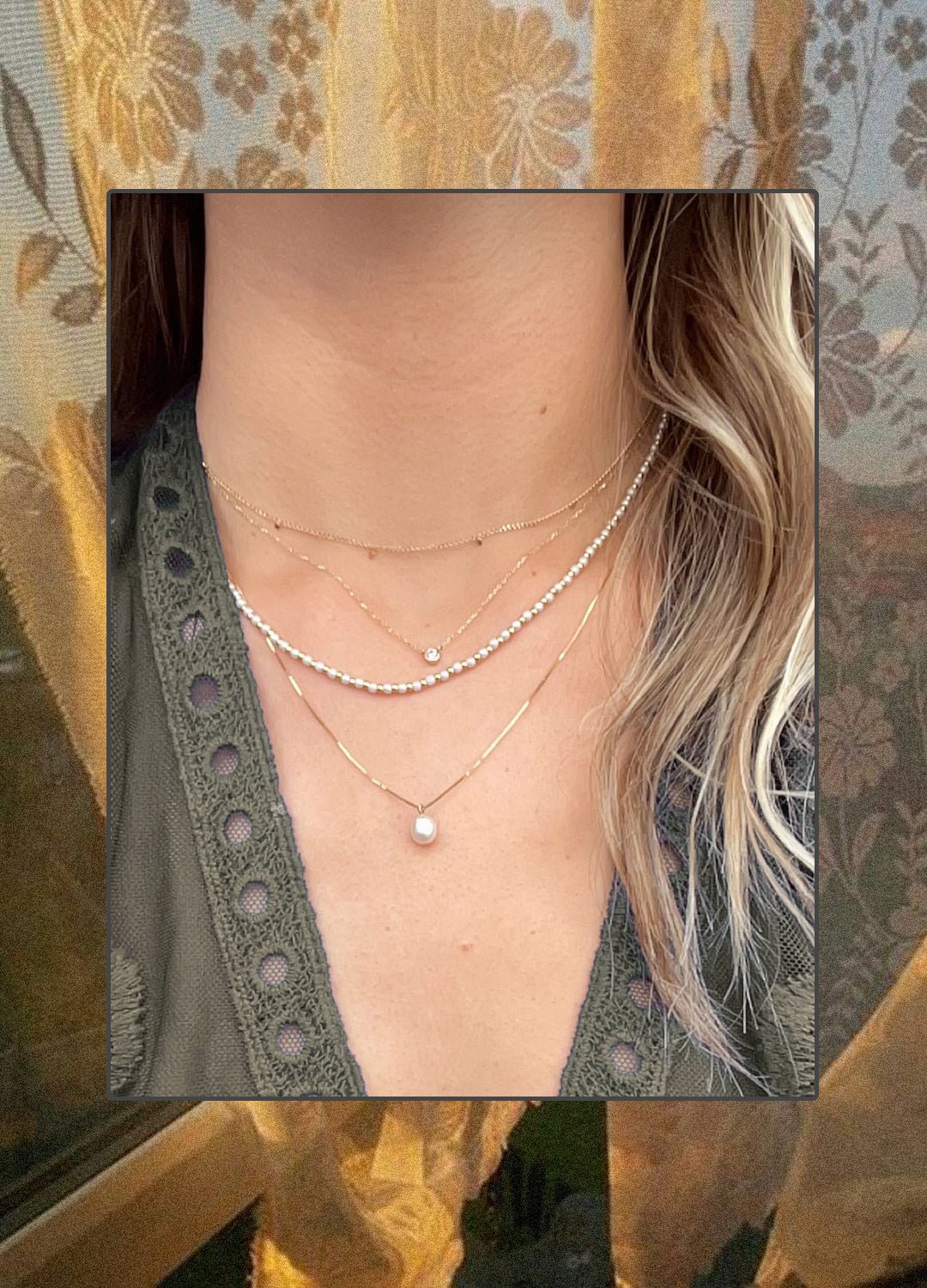 Woman wearing pearl necklaces and 14k gold diamond and chains. 