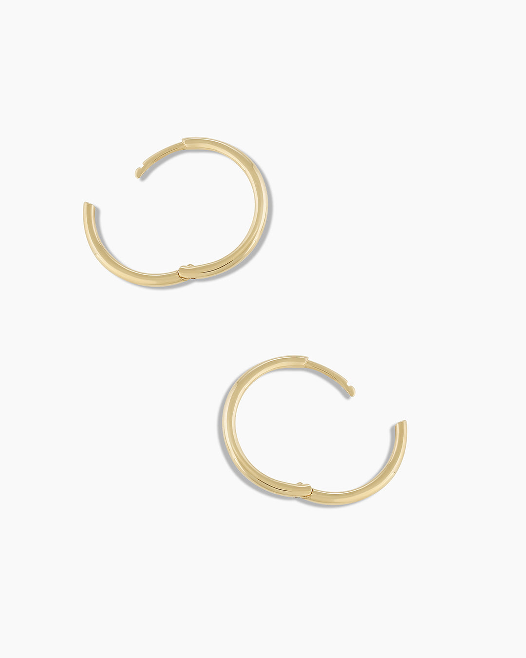 Woman wearing Classic Gold Huggie || option::14k Solid Gold, 15mm