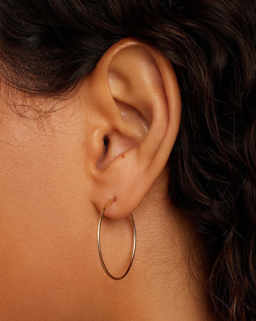 Woman wearing Classic Gold Hoop || option::14k Solid Gold, 30mm