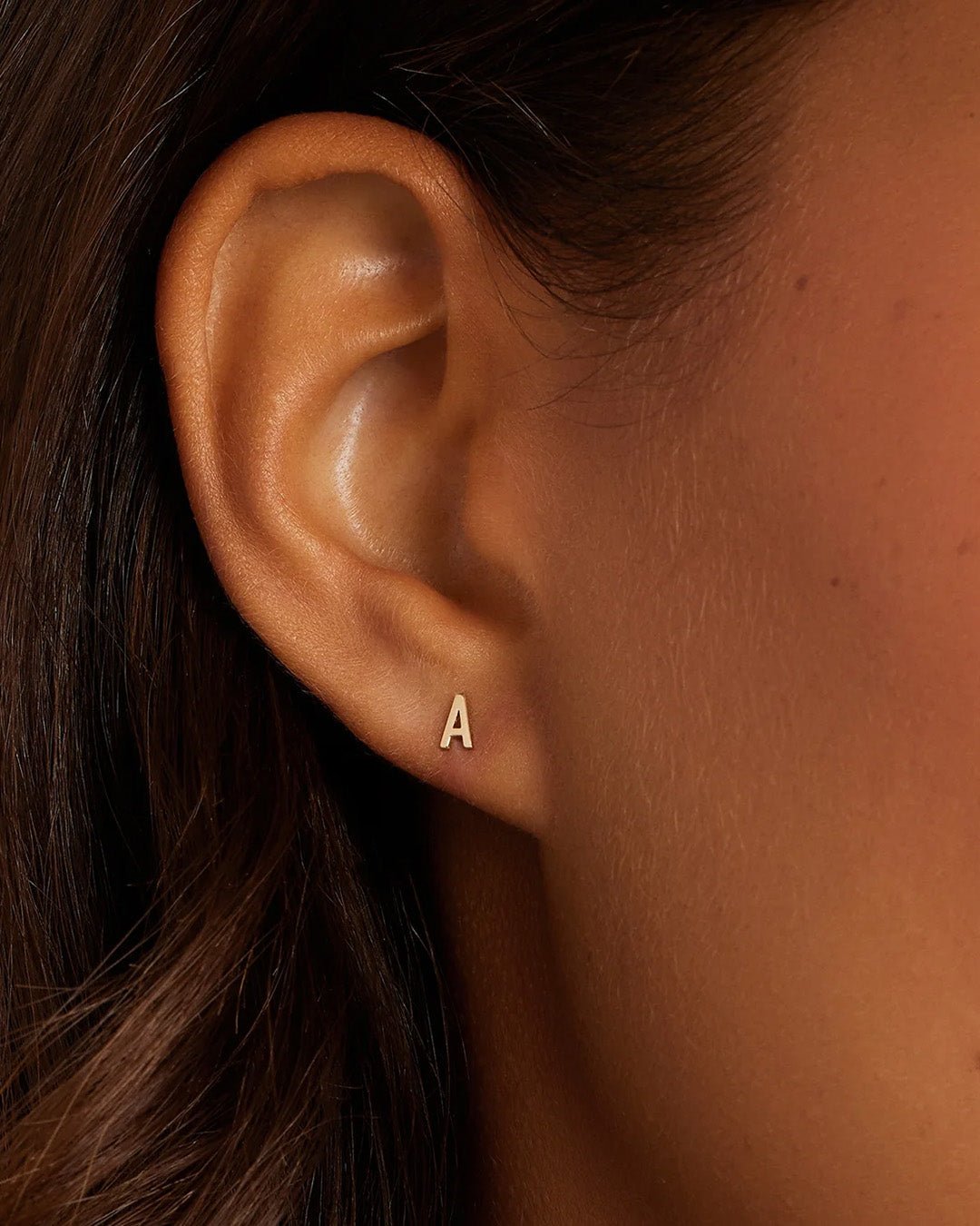 Woman wearing alphabet earring stud || option::14k Solid Gold, A, Single