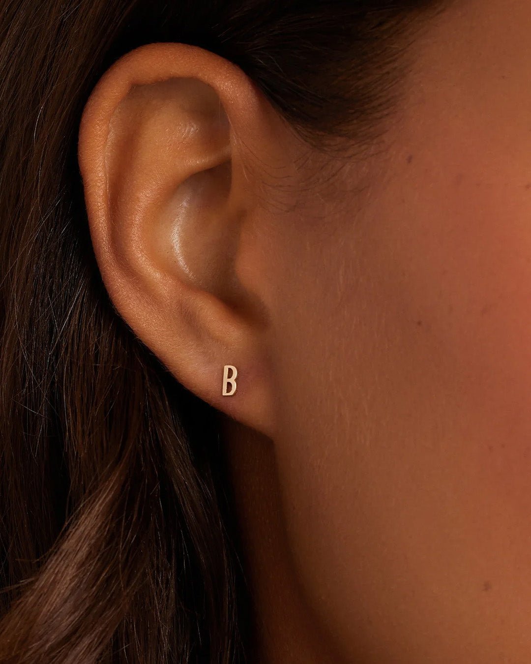 Woman wearing alphabet earring stud || option::14k Solid Gold, B, Single