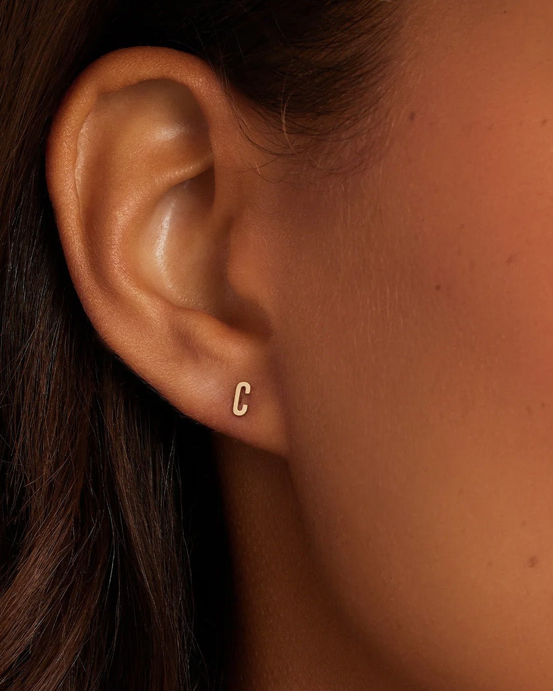Woman wearing alphabet earring stud || option::14k Solid Gold, C, Single