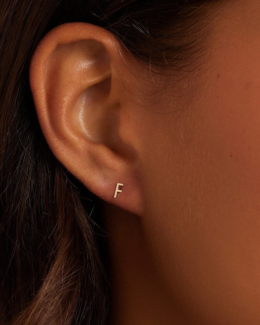 Woman wearing alphabet earring stud || option::14k Solid Gold, F, Single
