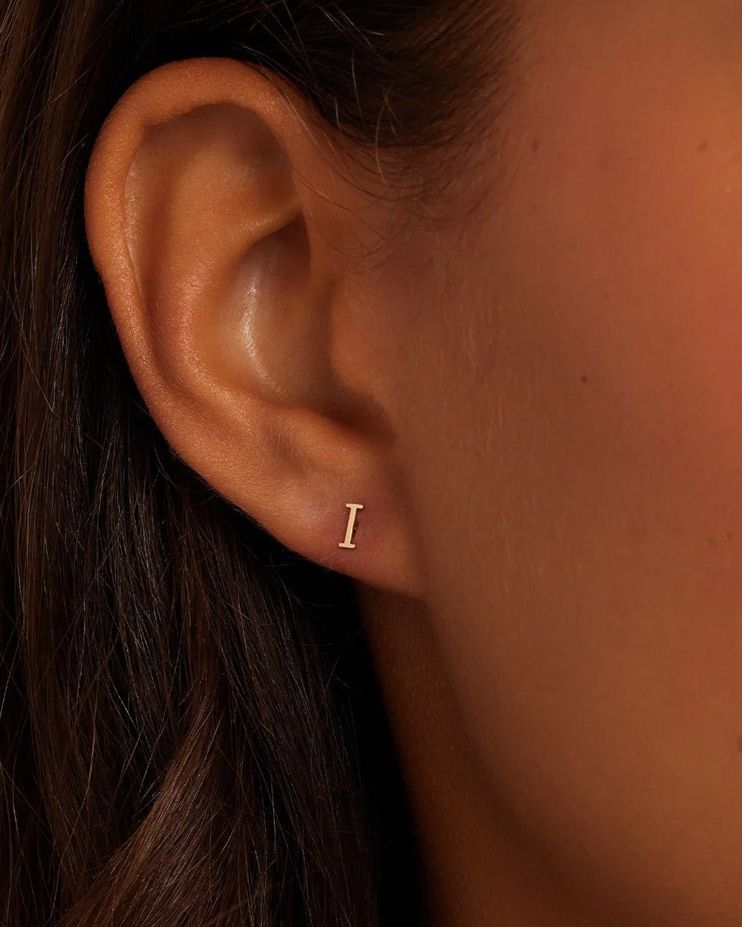 Woman wearing alphabet earring stud || option::14k Solid Gold, I, Single