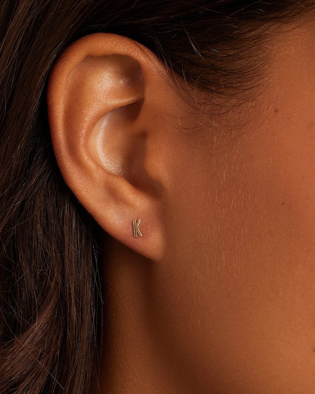 Woman wearing alphabet earring stud || option::14k Solid Gold, K, Single